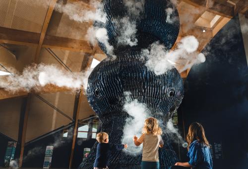 Family looking at Infinity Blue sculpture